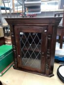 A pine stained corner cabinet