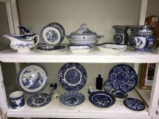 2 shelves of blue and white pottery