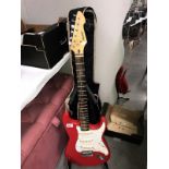 A Peavey Raptor electric guitar (neck straight,