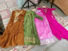 3 Indian tunics with trousers and an Indian tunic.