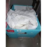 A box of assorted net curtains etc.