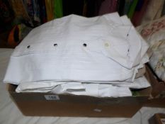 A box of shirts including dress shirts.
