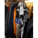 Approximately 10 ladies suits in assorted styles and sizes.