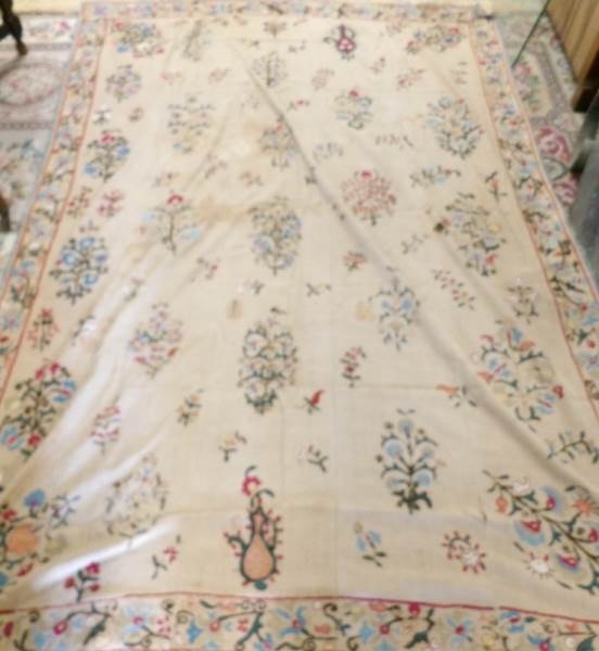 An antique embroidered bed cover, 230 x 160 cm (badly stained).