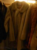 A faux fur three quarter length coat.