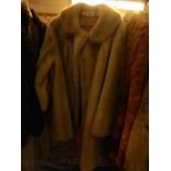 A faux fur three quarter length coat.