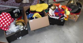 4 boxes of assorted fancy dress hats.