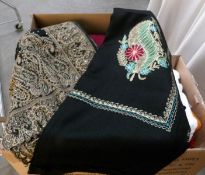 A quantity of shawls in various colours and patterns.