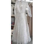 A circa 1950's lace wedding dress set with diamonte' and pearls to front with fine net neck area.