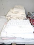 A large quantity of assorted bed linen.