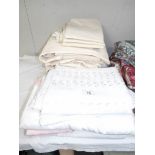 A large quantity of assorted bed linen.