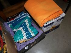 2 boxes of crocheted and other blankets.