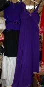 A purple evening dress and a day dress.