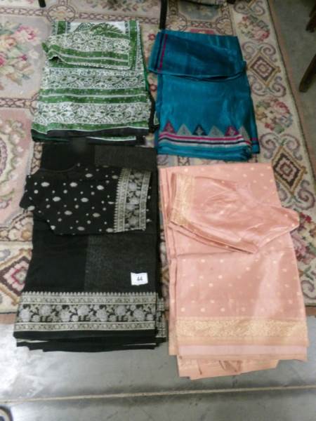 4 Indian sari's complete with tops in various colours.