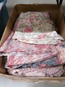 A box of assorted curtains.