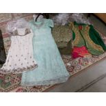 4 Indian outfits in various colours.