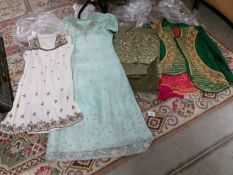 4 Indian outfits in various colours.