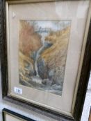 A framed and glazed watercolour of a waterfall.