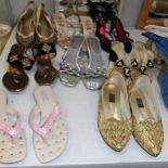 A quantity of shoes and sandals.