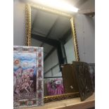 A decorative gilded mirror