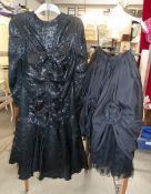 A Frank Usher black evening dress and a black and lace skirt.