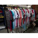 Approximately 130 assorted ladies tops and blouses, many unworn.