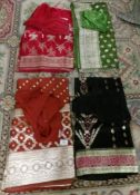 4 Indian sari's complete with tops in various colours.