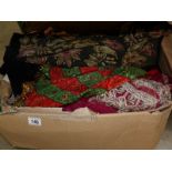 A large box of assorted sari's and shawls etc.