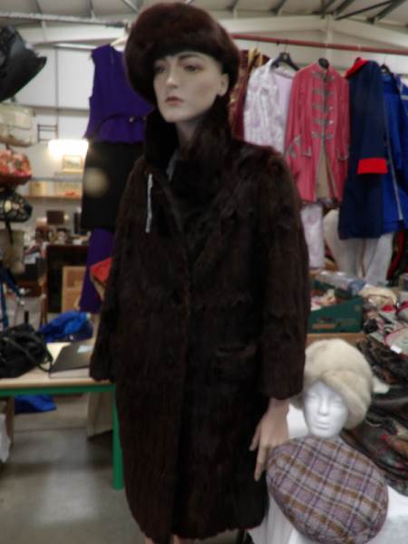 A ladies fur coat, 2 fur hats and a vintage tweed hat.