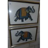 A pair of framed and glazed studies of elephants on silk.