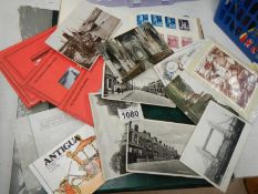 A postcard album, loose postcards, stamp booklets etc.