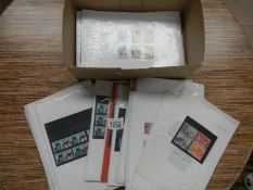 A box of stamps (sleeved) mint and used sets,