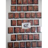 A GB album including approximately 136 one penny reds, 6 two penny blues,