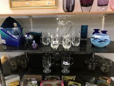 Two shelves of mixed glassware including: water jug set, art glass,
