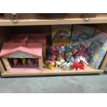 A collection of vintage 'my little pony' figures including rare examples and a show stable.