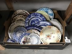 A box of collectors plates including blue & white & Lincoln Cathedral etc.