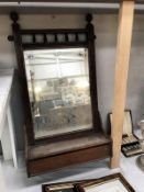 An Edwardian mahogany bathroom mirror