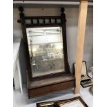 An Edwardian mahogany bathroom mirror