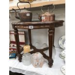 A wooden pie crust shape table with glass insert & gallery