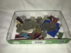 A selection of coins and medals etc.