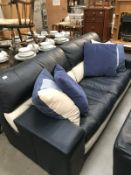A blue & white sofa & cushions