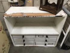 A painted/shabby chic workshop storage cabinet