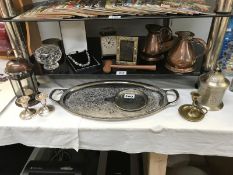 Two shelves of mixed silver plate and copper ware.