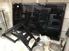 A Samsung flat screen TV & wall bracket