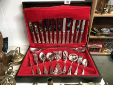 Caned canteen of cutlery and large quantity of brassware.