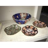 A quantity of oriental plates and dishes - some A/F