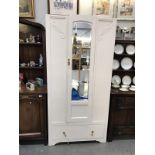 A 1930's painted oak wardrobe with bevelled mirror door.