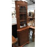 A corner display cabinet with keys