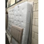 A single divan bed and mattress with headboard