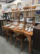 A pine kitchen table & 6 chairs